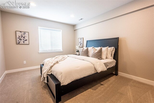 bedroom with light carpet, baseboards, and recessed lighting