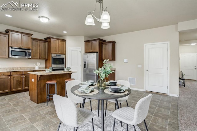 dining space with recessed lighting, an inviting chandelier, visible vents, light tile patterned floors, and baseboards
