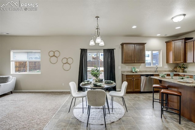 dining room featuring baseboards and recessed lighting