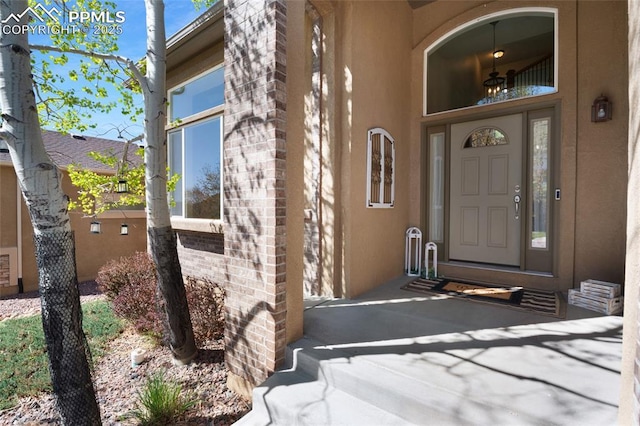 7436 Centennial Glen Dr, Colorado Springs, CO 80919 - doorway to property with brick siding and stucco siding