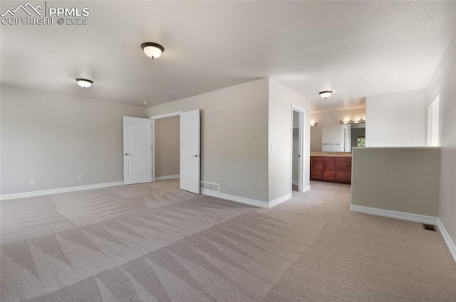 7436 Centennial Glen Dr, Colorado Springs, CO 80919 - spare room with visible vents, baseboards, and light colored carpet