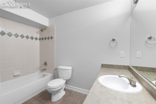 7436 Centennial Glen Dr, Colorado Springs, CO 80919 - bathroom with vanity, tub / shower combination, toilet, baseboards, and tile patterned floors