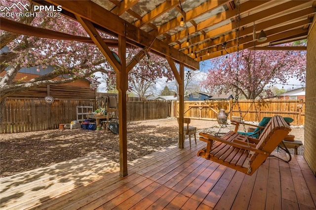 1514 Howard Ave, Colorado Springs, CO 80909 - deck with a fenced backyard and a pergola