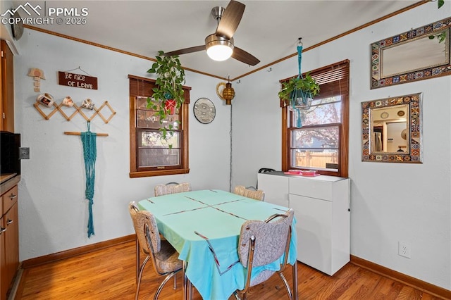 1514 Howard Ave, Colorado Springs, CO 80909 - dining space with ornamental molding, light wood-style flooring, baseboards, and ceiling fan