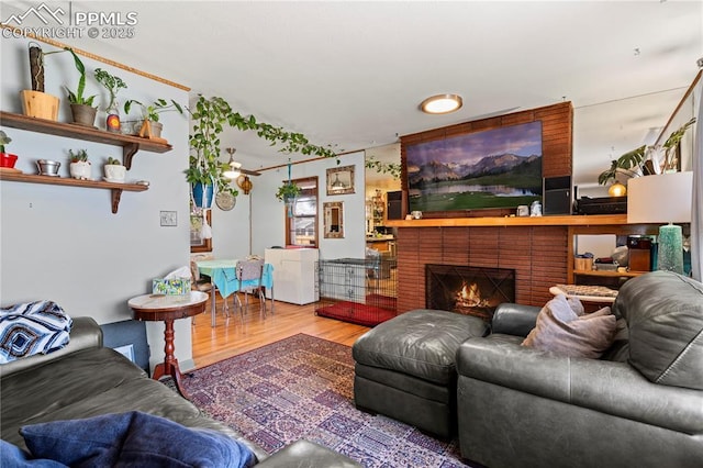 1514 Howard Ave, Colorado Springs, CO 80909 - living room featuring a fireplace and wood finished floors