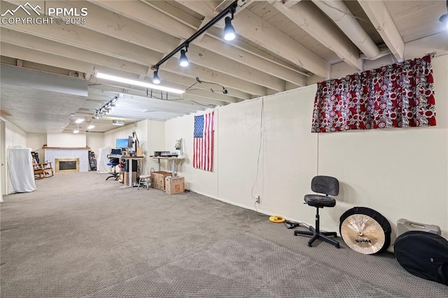 1514 Howard Ave, Colorado Springs, CO 80909 - miscellaneous room with a tiled fireplace and carpet floors