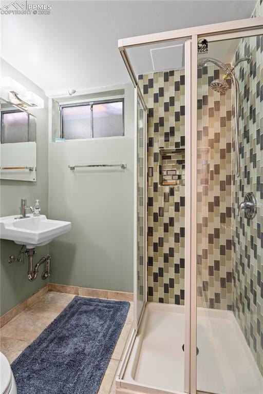 1514 Howard Ave, Colorado Springs, CO 80909 - full bath with tile patterned floors, a stall shower, and a sink