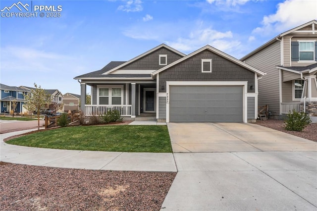 craftsman-style home featuring a porch, a front yard, driveway, and an attached garage