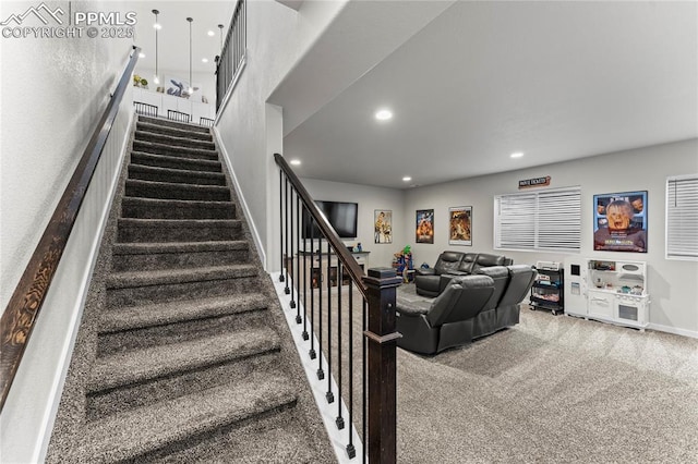 stairway featuring baseboards, recessed lighting, and carpet floors