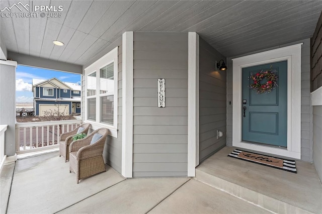doorway to property featuring covered porch