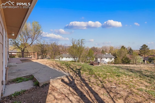 view of yard with a patio and a deck