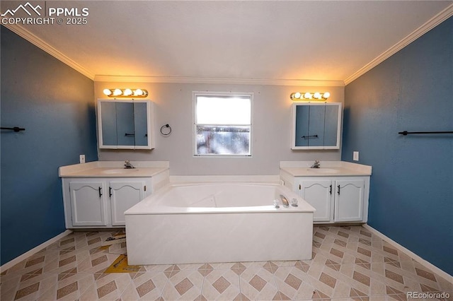 bathroom with two vanities, a garden tub, crown molding, and baseboards