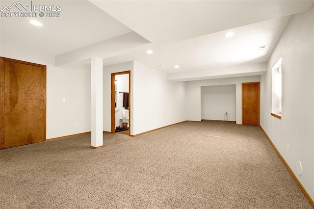 basement featuring baseboards, recessed lighting, and carpet flooring