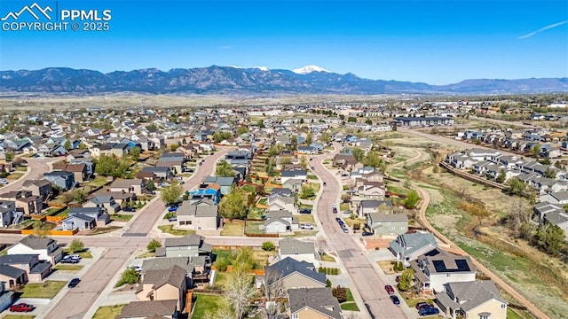 birds eye view of property featuring a residential view and a mountain view