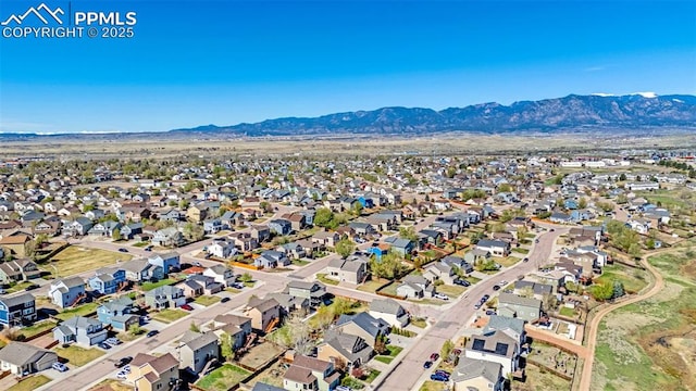 aerial view featuring a mountain view and a residential view