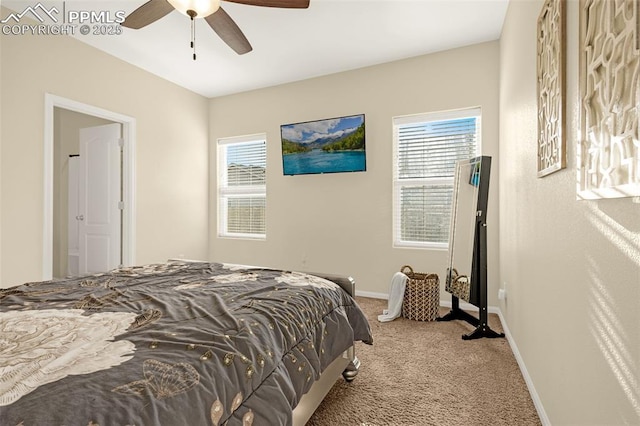 carpeted bedroom featuring ceiling fan, baseboards, and multiple windows