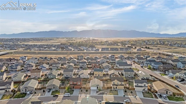 birds eye view of property with a residential view and a mountain view