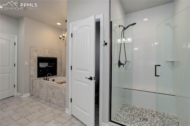 full bath with baseboards, a stall shower, recessed lighting, and a bath