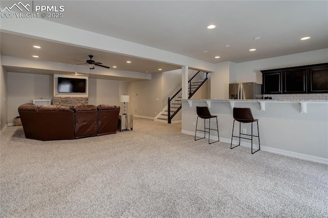 10704 Shavano Peak Ct, Peyton, CO 80831 - living area featuring light carpet, recessed lighting, and stairs