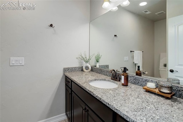 bathroom with visible vents and vanity