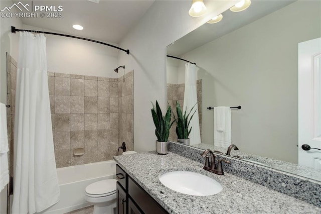 bathroom with vanity, shower / tub combo with curtain, and toilet