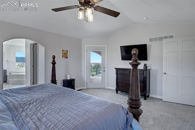 15930 Alta Plaza Cir, Peyton, CO 80831 - carpeted bedroom featuring arched walkways, lofted ceiling, access to exterior, ceiling fan, and connected bathroom