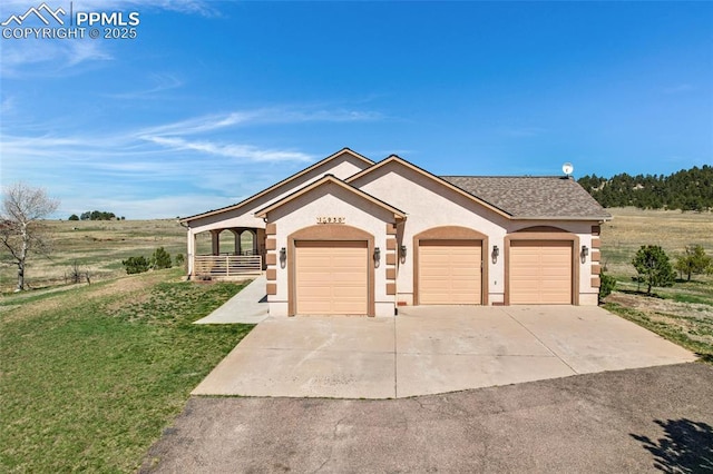 15930 Alta Plaza Cir, Peyton, CO 80831 - ranch-style home featuring stucco siding, an attached garage, a front yard, driveway, and roof with shingles