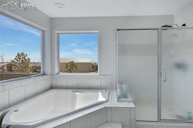 15930 Alta Plaza Cir, Peyton, CO 80831 - full bathroom featuring a stall shower and a garden tub