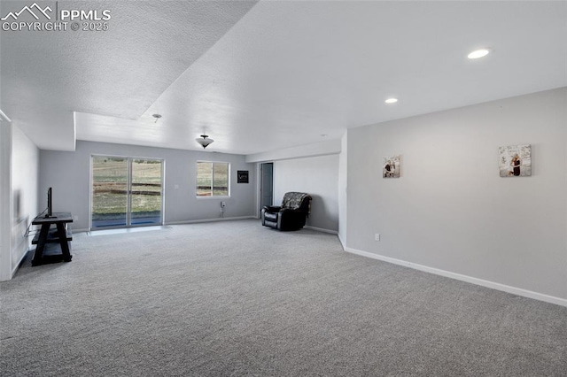 15930 Alta Plaza Cir, Peyton, CO 80831 - unfurnished living room with carpet floors and recessed lighting