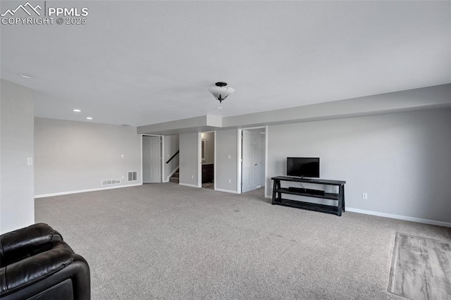 15930 Alta Plaza Cir, Peyton, CO 80831 - unfurnished living room featuring stairway, carpet floors, and recessed lighting