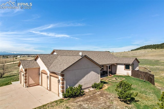 15930 Alta Plaza Cir, Peyton, CO 80831 - ranch-style home with a garage, driveway, a shingled roof, and stucco siding