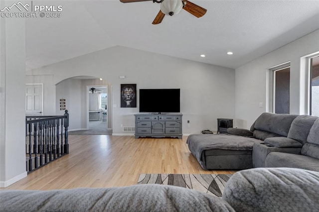 15930 Alta Plaza Cir, Peyton, CO 80831 - living room featuring ceiling fan, arched walkways, wood finished floors, and lofted ceiling