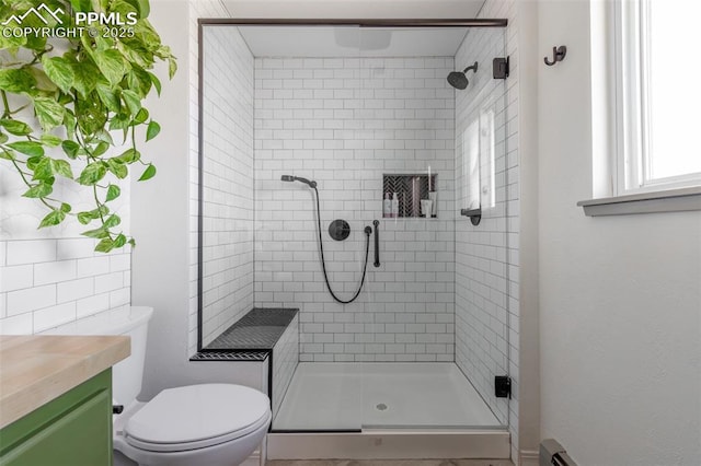 full bath with toilet, a shower stall, and vanity