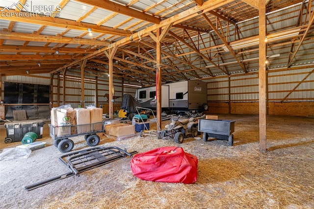 interior space with a garage and vaulted ceiling