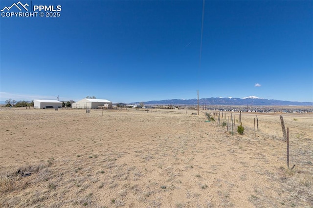 property view of mountains featuring a rural view