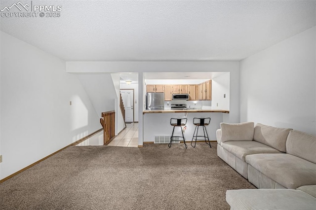 living room featuring light carpet