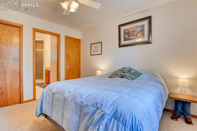 bedroom featuring carpet floors, a ceiling fan, baseboards, and two closets