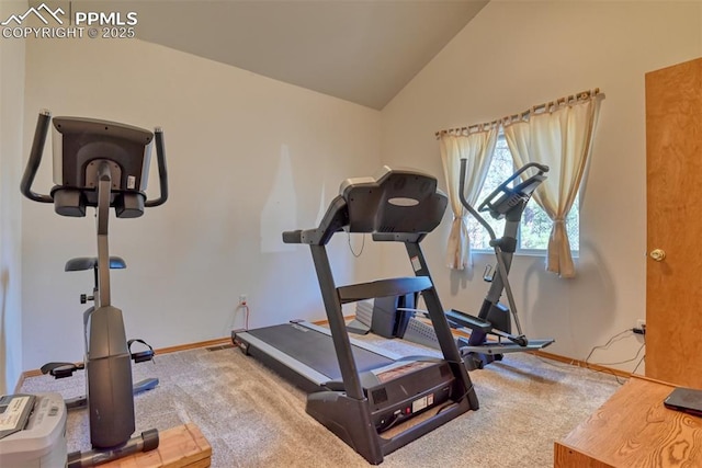 exercise area with lofted ceiling, carpet floors, and baseboards