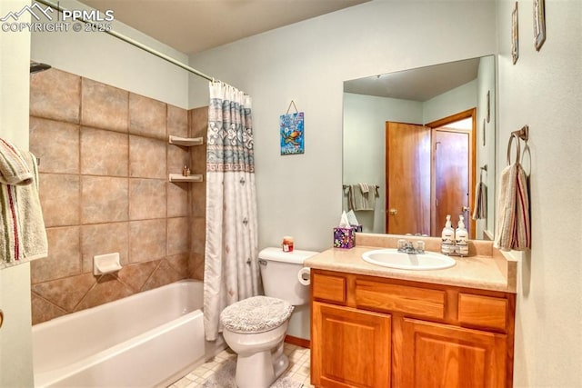bathroom featuring shower / tub combo, toilet, and vanity