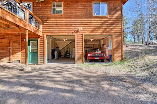garage featuring driveway
