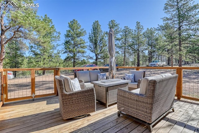 wooden deck with an outdoor living space