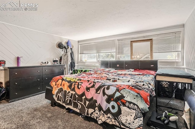 carpeted bedroom featuring a textured ceiling