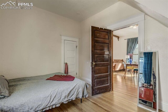 519 W Bijou St, Colorado Springs, CO 80905 - bedroom featuring baseboards and light wood-style floors