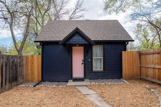 519 W Bijou St, Colorado Springs, CO 80905 - view of front of home with a fenced backyard and roof with shingles