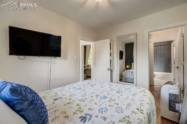 519 W Bijou St, Colorado Springs, CO 80905 - bedroom featuring heating unit and wood finished floors