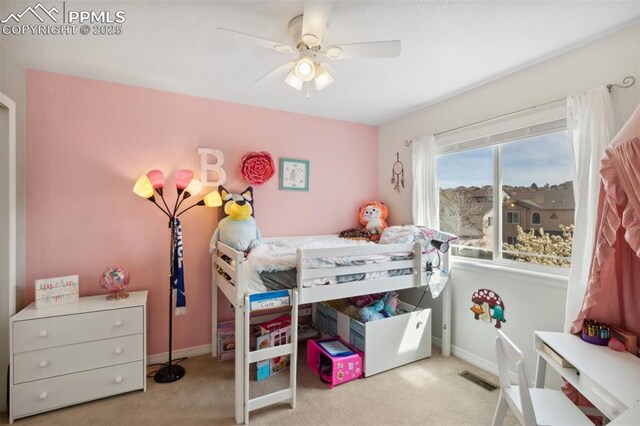 carpeted bedroom featuring visible vents, ceiling fan, and baseboards