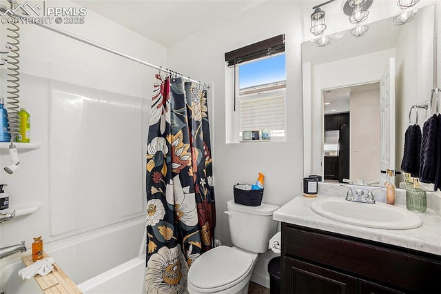 full bathroom featuring shower / bath combo, toilet, and vanity
