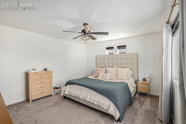 bedroom featuring carpet flooring, baseboards, and ceiling fan