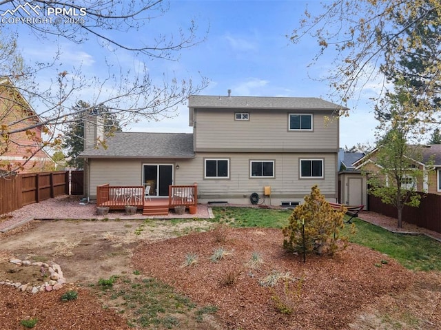 840 Quail Lake Cir, Colorado Springs, CO 80906 - back of house featuring a deck, a chimney, a fenced backyard, and a shingled roof