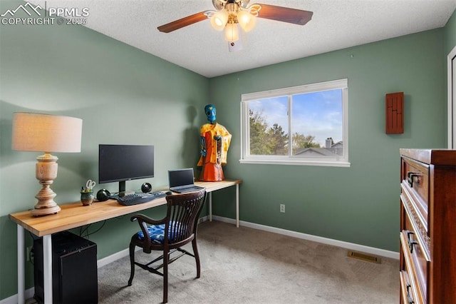 840 Quail Lake Cir, Colorado Springs, CO 80906 - home office with a textured ceiling, ceiling fan, carpet flooring, and baseboards